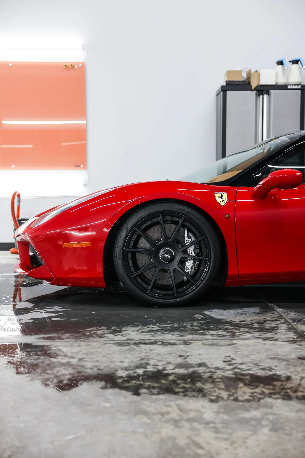 Ferrari 488 front wheel and fender at the Collectors Car Spa studio in Orlando